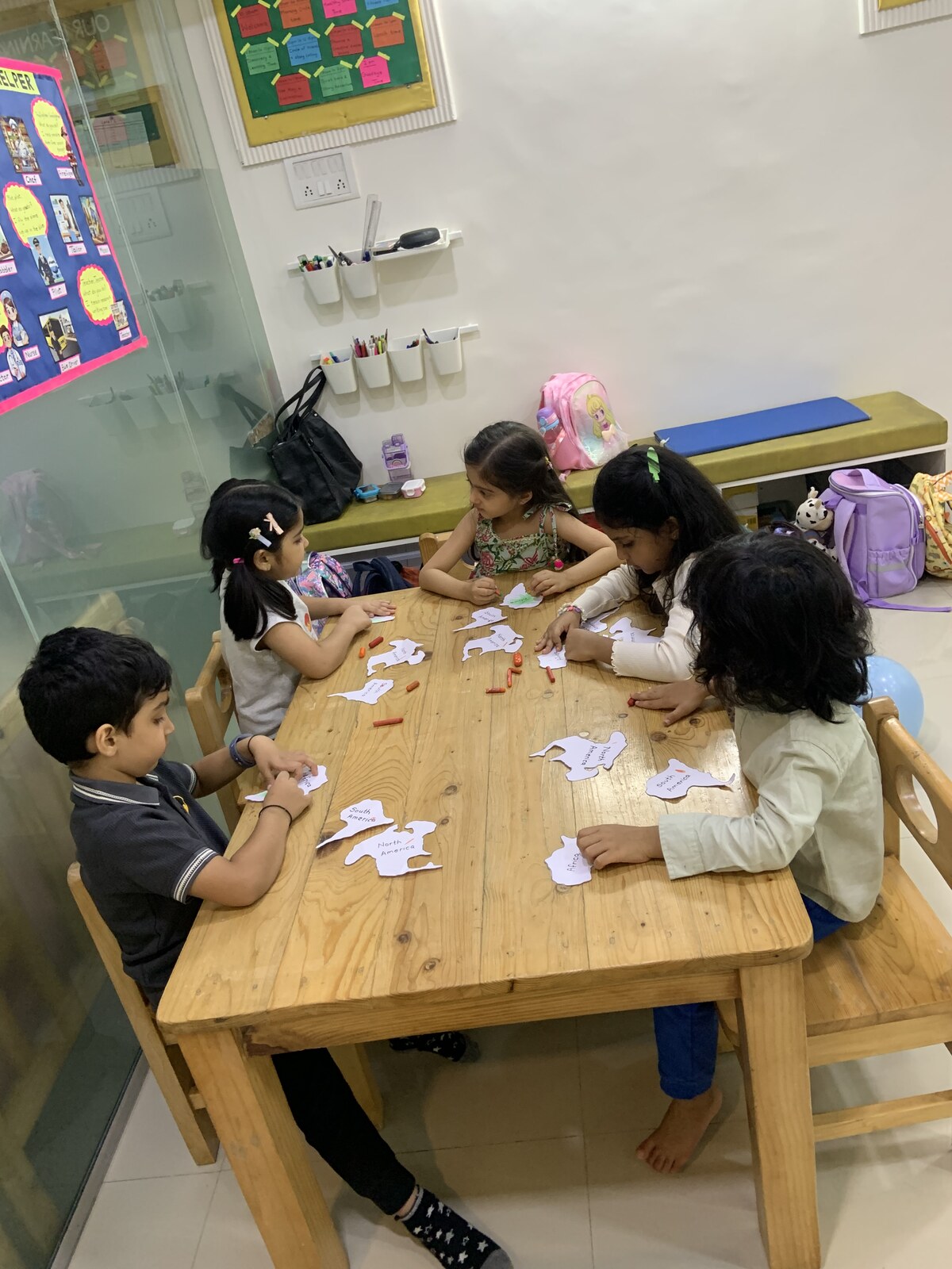 Child working independently on a creative classroom activity